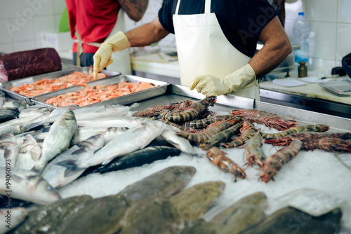 Closeup of store tray with seafood and fish in marketplace
