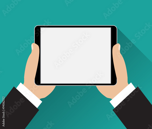 Hands holding black tablet computer 