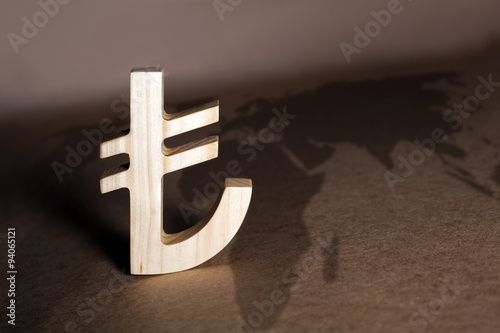Fototapeta Naklejka Na Ścianę i Meble -  Wooden economy and currency units on craft background