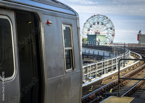 Stopped train in an elevated subway station overlooking Coney Island in Brooklyn, New York