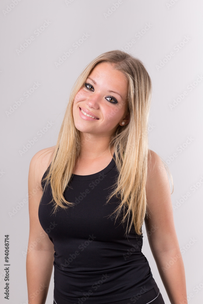 Beautiful girl in sports uniform, posing after training. Close-up portrait. Beautiful girl in sports uniform, posing after training. Close-up portrait.