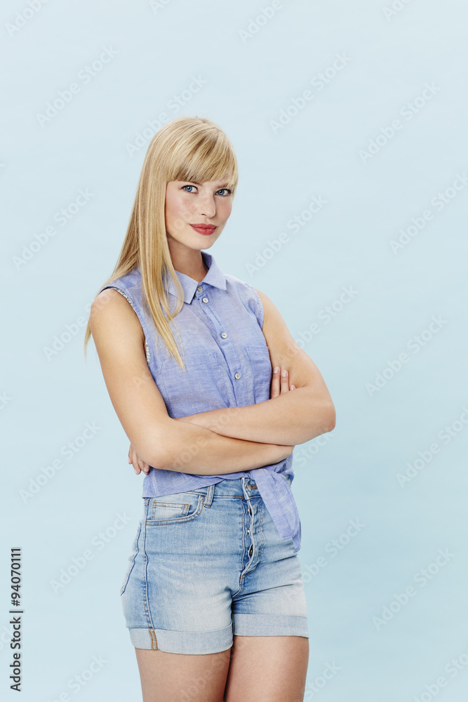 Smiling young woman in shorts, portrait Smiling young woman in shorts, portrait