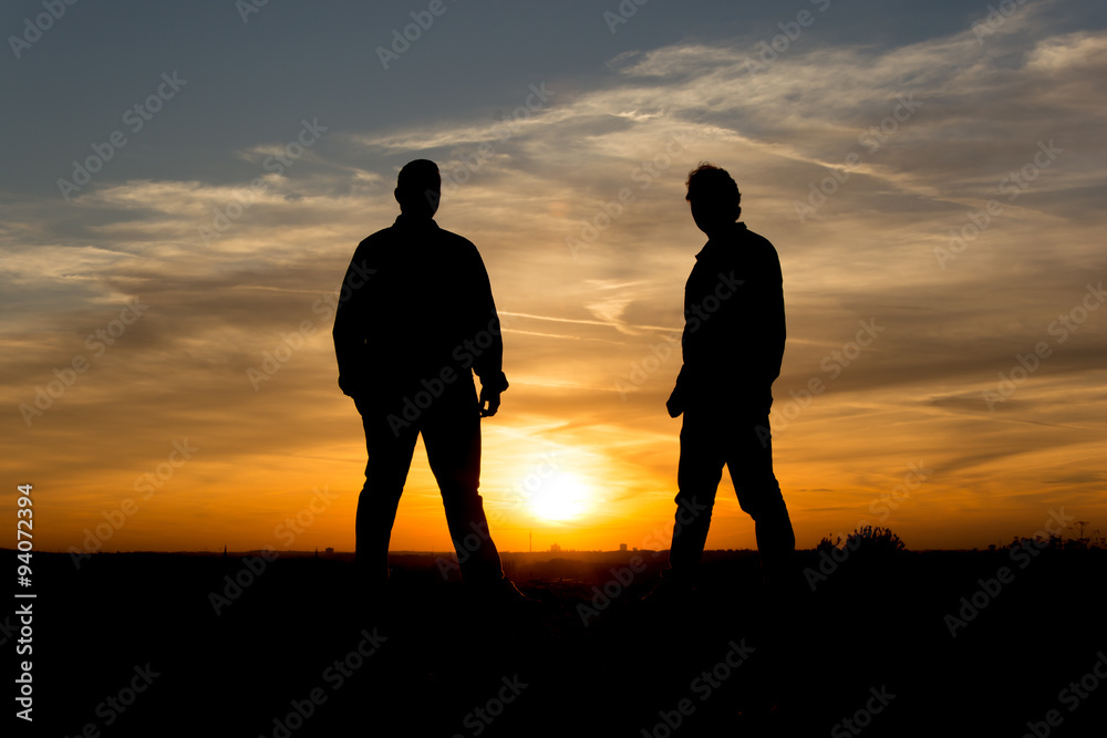 People Silhouette / Two men standing in the sunset