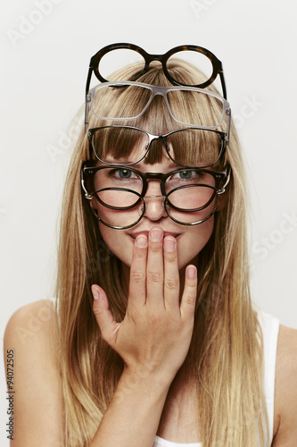 Fotografia Young female student of many spectacles