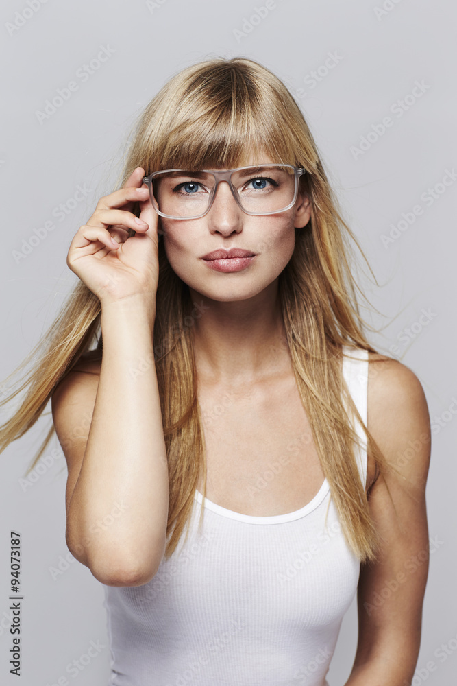 Beautiful blond woman in eyeglasses, portrait