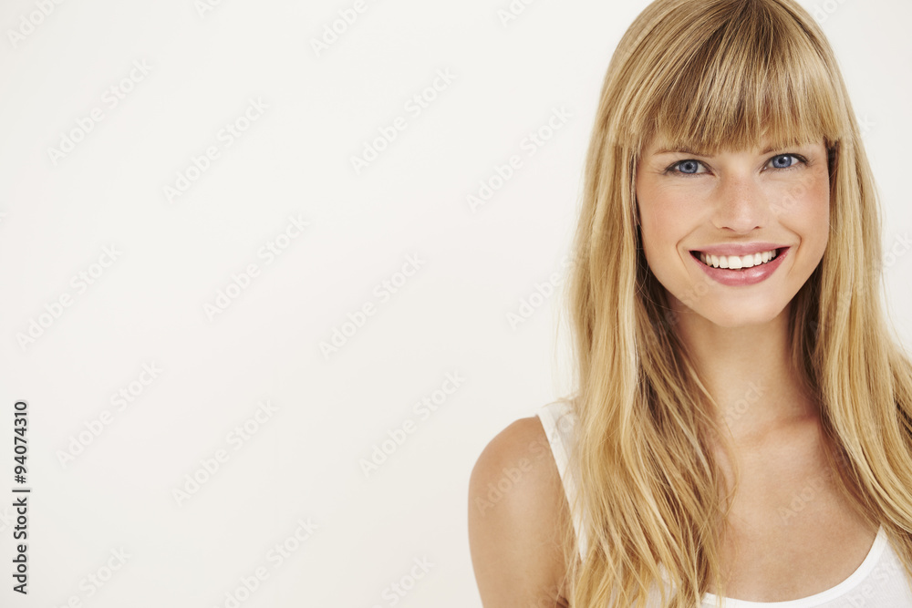 Young woman smiling at camera, portrait Young woman smiling at camera, portrait