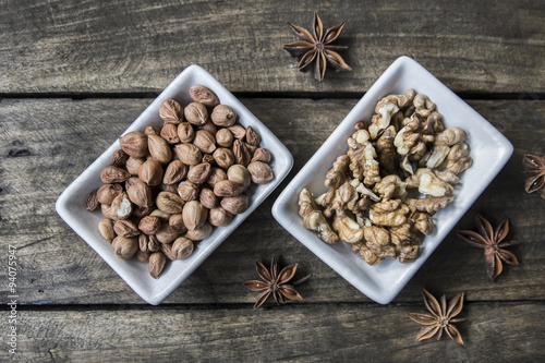 walnuts and hazelnuts on wooden table