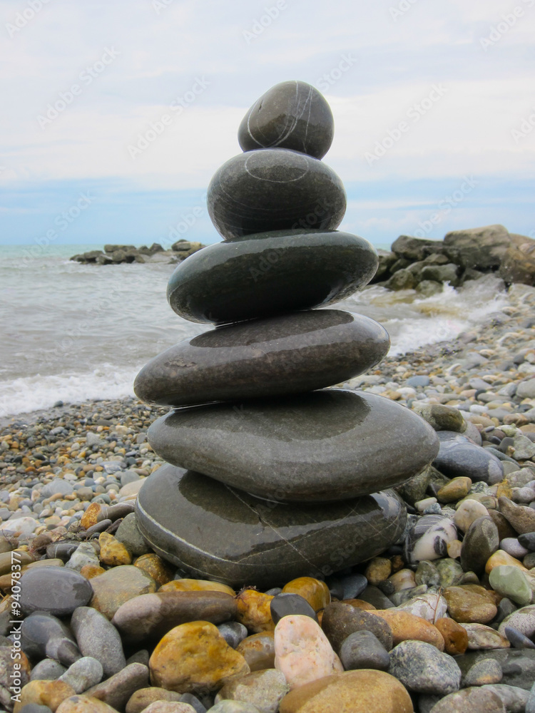 The pyramid of six stones on the beach. The pyramid of six stones on the beach.