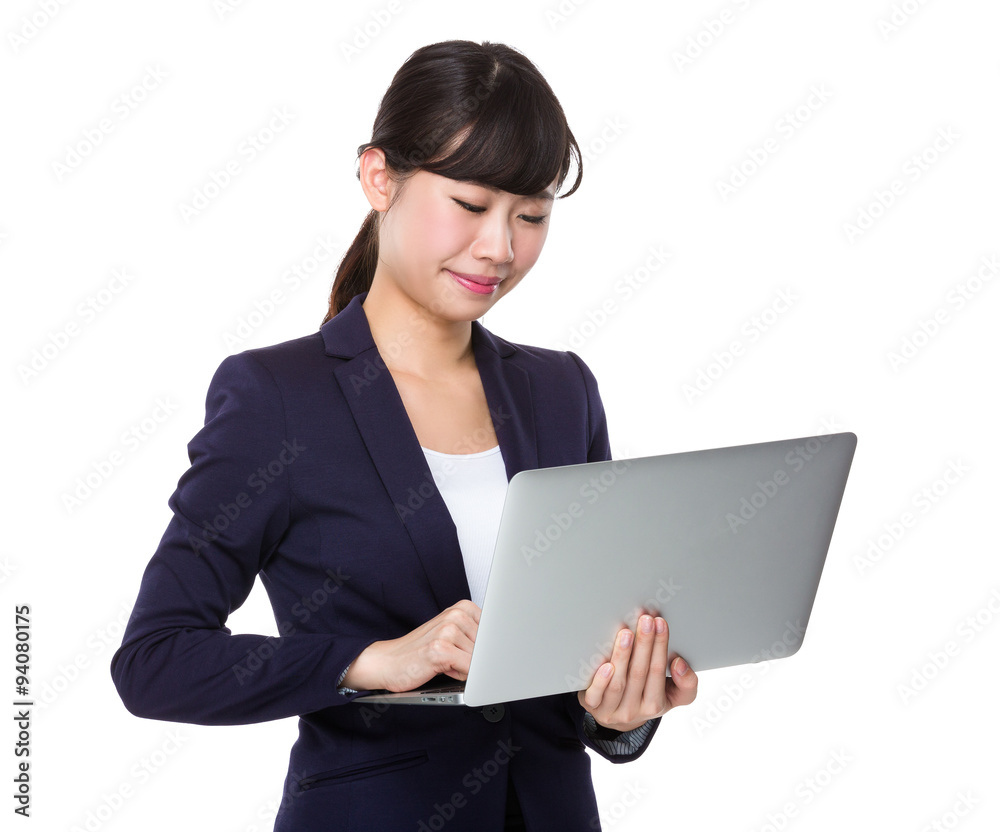 Asian Businesswoman use of the laptop computer Asian Businesswoman use of the laptop computer