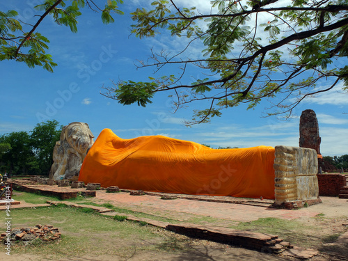 Reclining Buddha at Wat Phranon Old Temple with blue sky in Ayut photo