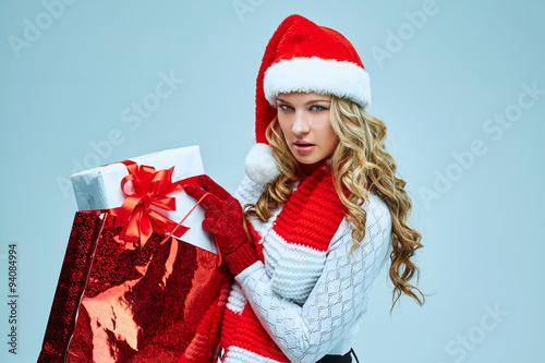 Beautiful young woman in Santa Claus clothes
