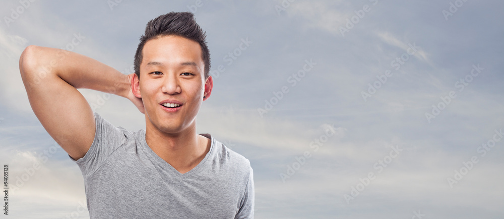 portrait of young asian man resting and smiling portrait of young asian man resting and smiling