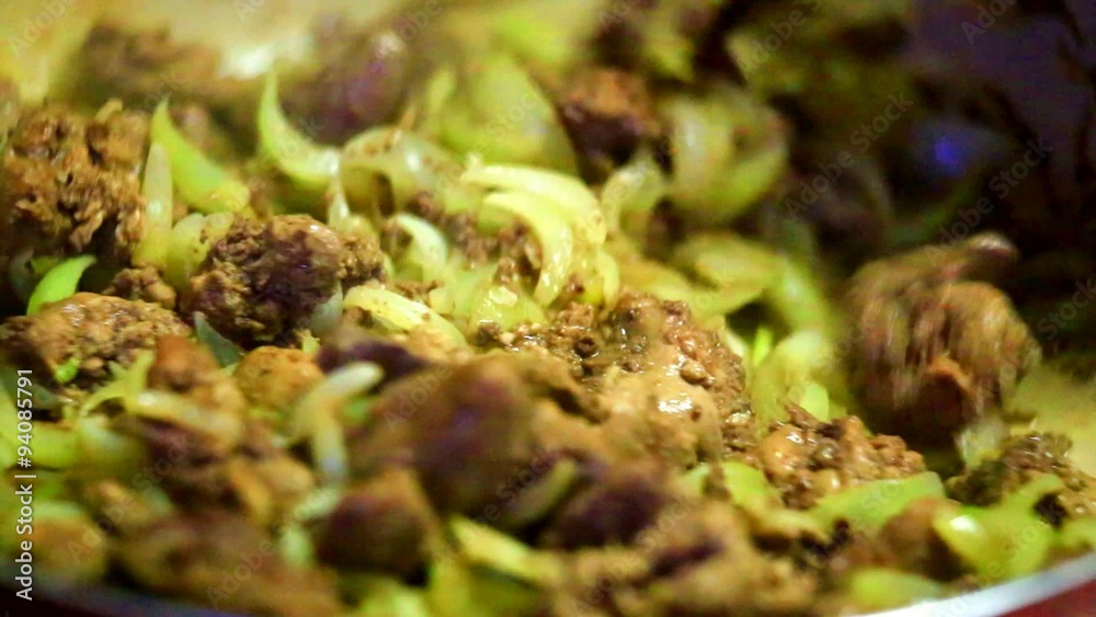 Cooking fresh meat with onion closeup Cooking fresh meat with onion closeup