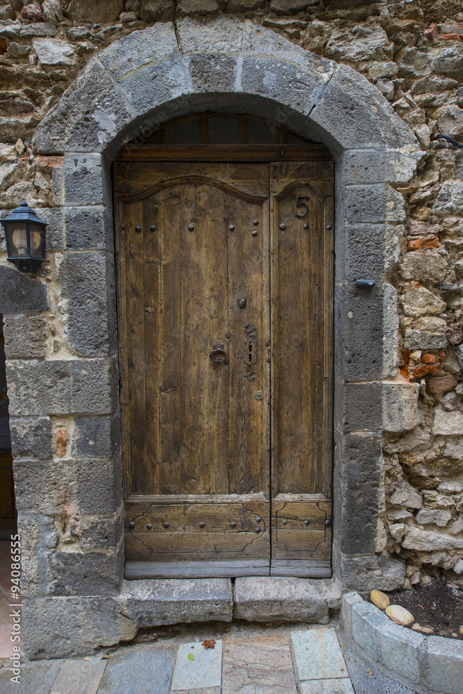 Historic wooden doors in the village Grimaund - Grimaud - France, Departement Var, Côte d‘Azur