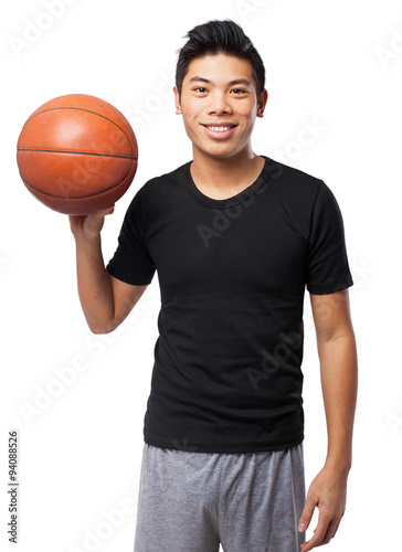 happy chinese sport man with basket ball © asierromero