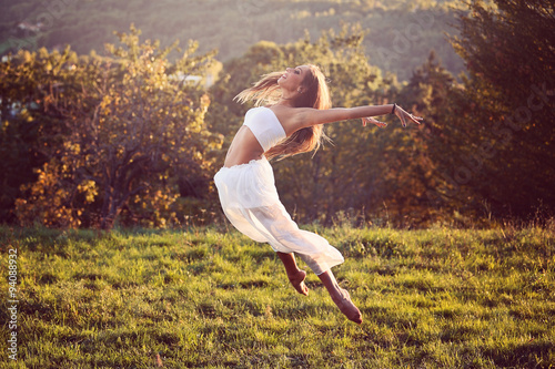 Beautiful dancer jumping outdoor