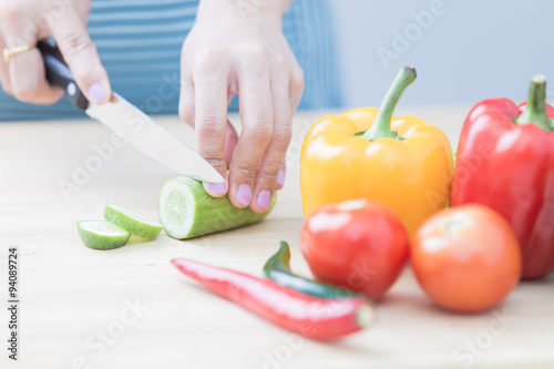 Salad preparation - cutting fresh vegetables into pieces