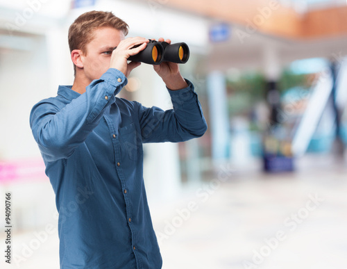 cool young-man with binoculars