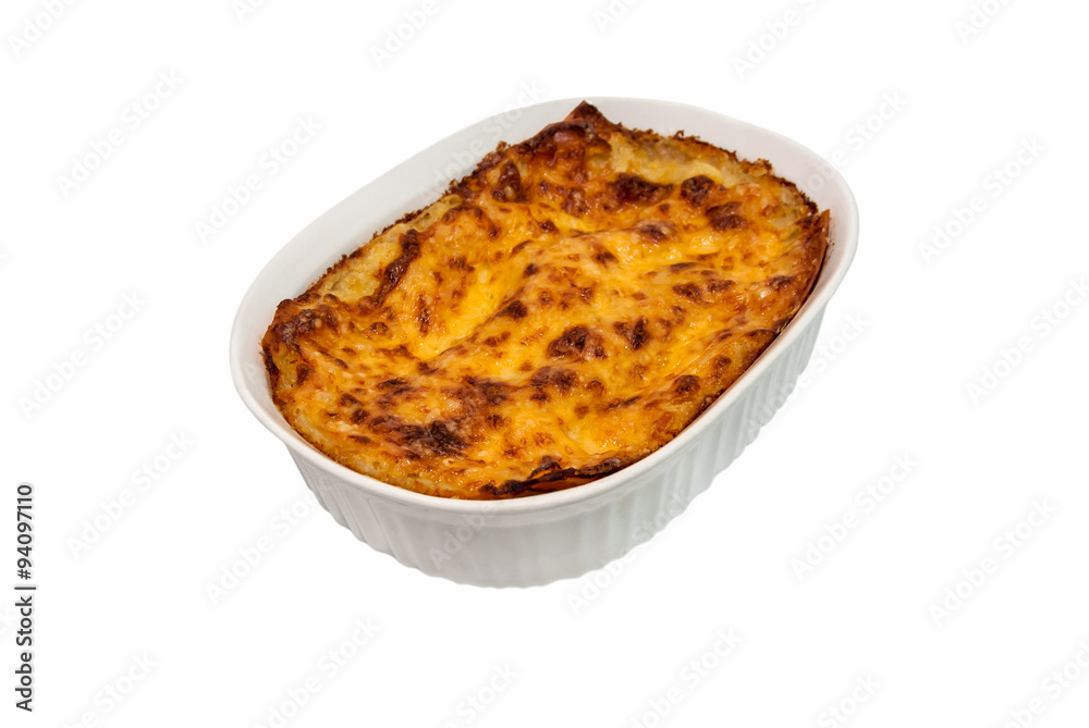 Lasagna in baking dish on a white background Lasagna in baking dish on a white background
