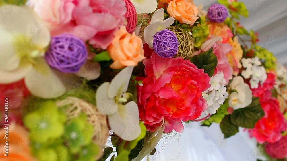 Beautiful details of place for outside wedding ceremony. Wedding floral decor. Close up of artificial flowers. Beautiful details of place for outside wedding ceremony. Wedding floral decor. Close up of artificial flowers.