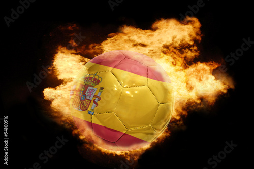 football ball with the flag of spain on fire