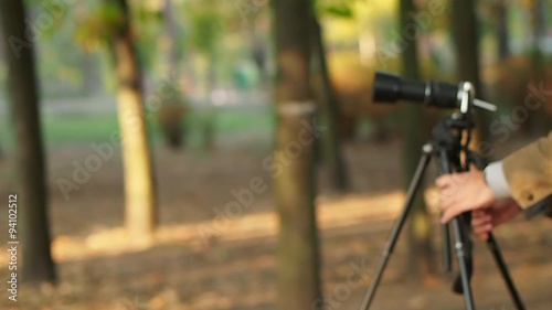 Photographer takes pictures with a tripod 