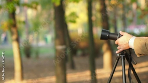 Photographer takes pictures with a tripod 