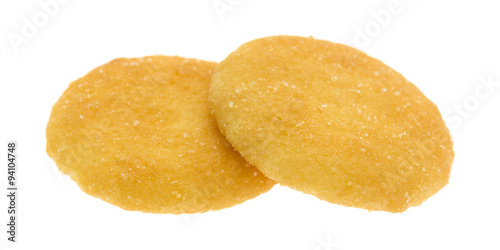 Two vanilla wafer cookies on a white background