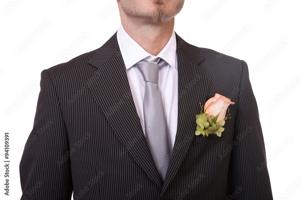 Detail of a groom's necktie and boutonniere Detail of a groom's necktie and boutonniere