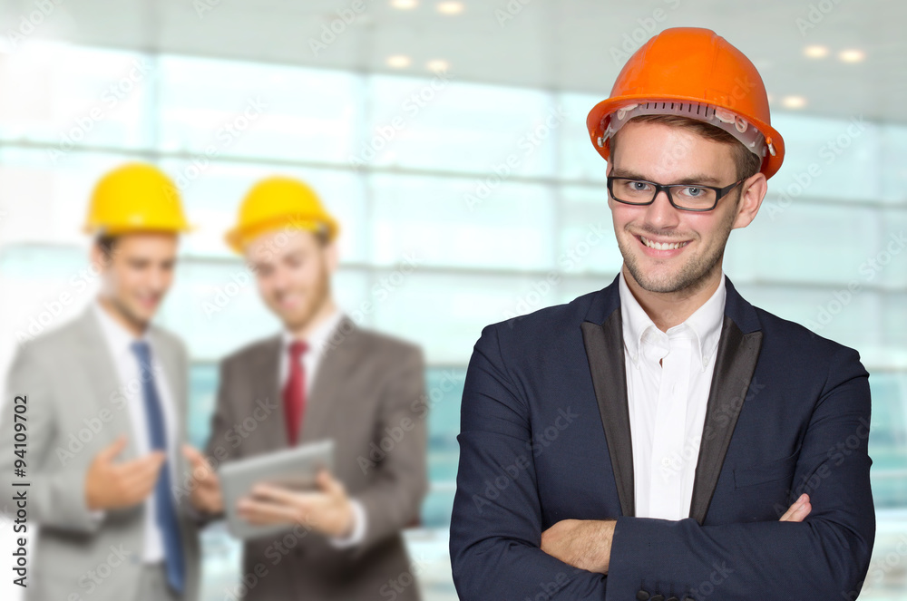 Young businessman wear a safety helmet Young businessman wear a safety helmet