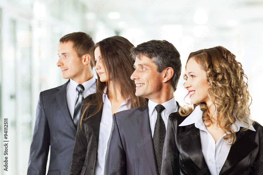 A group of attractive and successful business, ready for serious A group of attractive and successful business, ready for serious