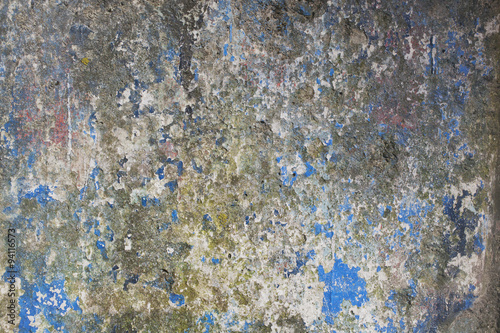 Abstract detail of an old weather worn concrete barrier.