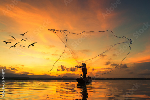 Print op canvas Fisherman fishing at lake in Morning, Thailand.