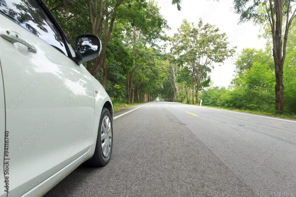 Fototapeta premium Stock Photo:.Car on asphalt road on summer day at park