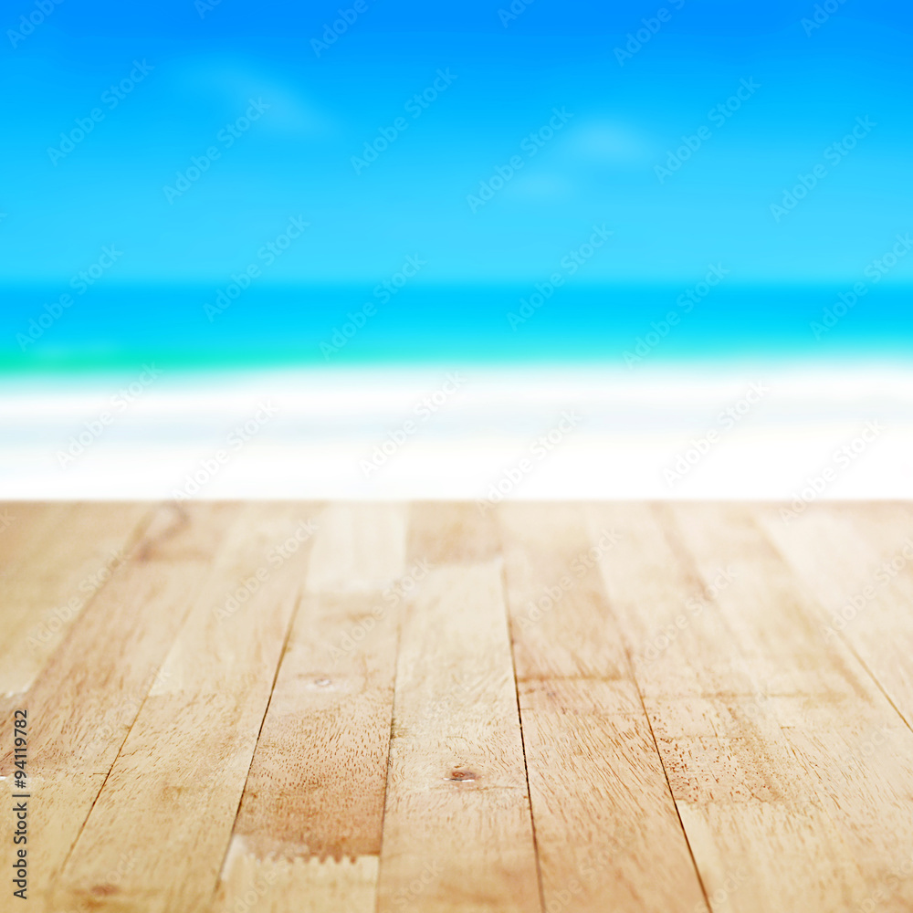 Wood table top on blurred beach background Wood table top on blurred beach background