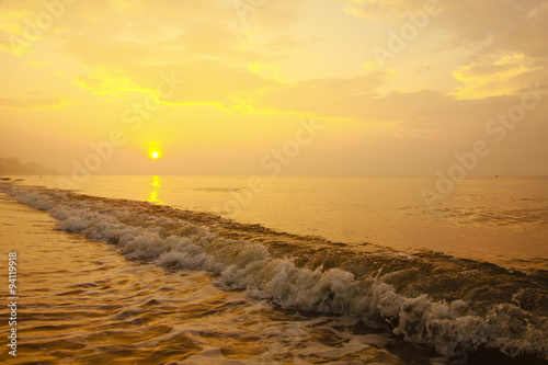 Stock Photo .Colorful sunset at the sand tropical beach