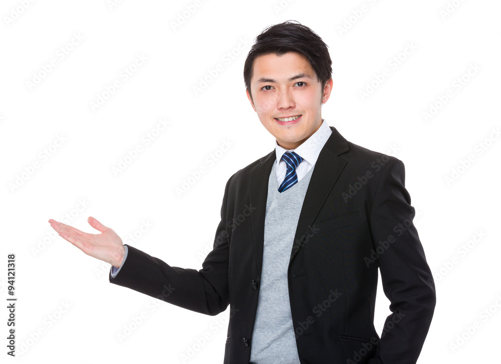 Asian businessman with hand showing blank sign Asian businessman with hand showing blank sign