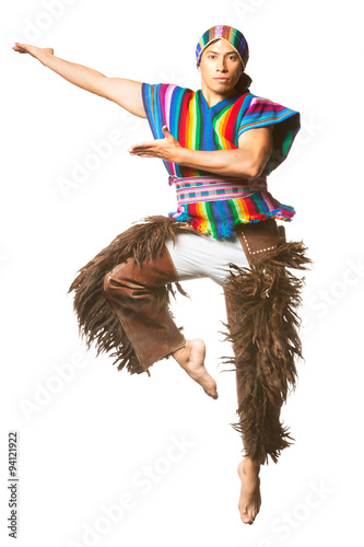 A dynamic studio shot featuring an Ecuadorian dancer in traditional Andean clothing leaping gracefully adorned with llama or alpaca themed pants perfectly isolated against a white background