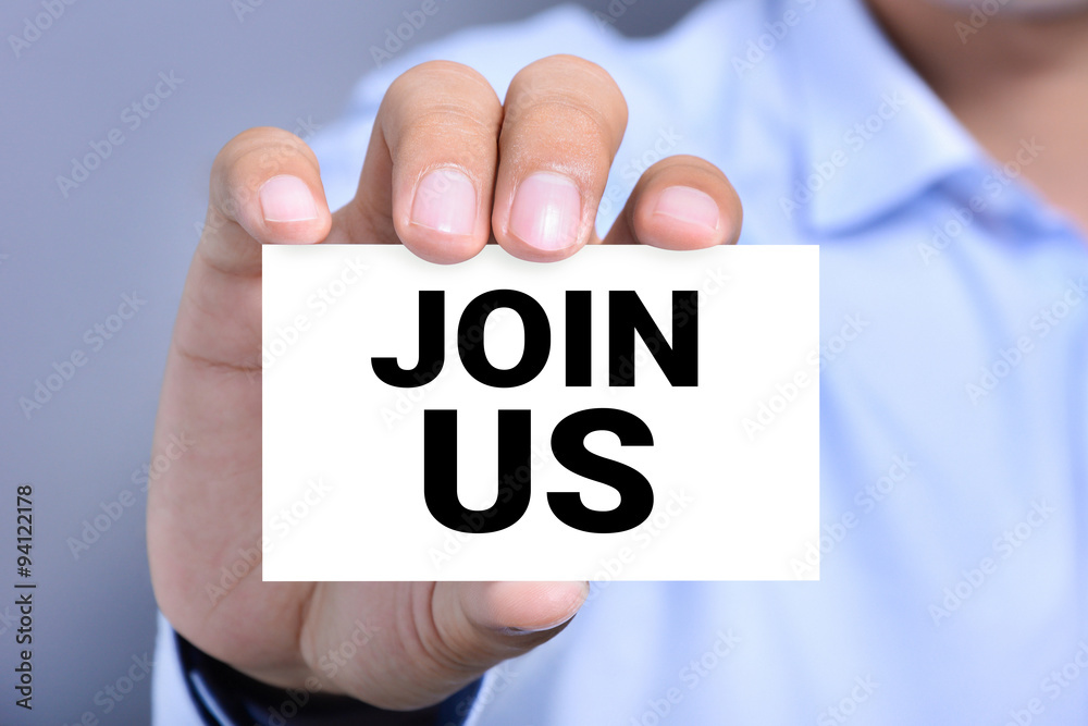 JOIN US, message on the card held by a man hand JOIN US, message on the card held by a man hand