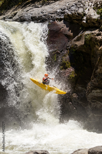 A kayaker takes on the extreme action of jumping a waterfall in Ecuador's Sangay region, navigating dangerous white water rapids.