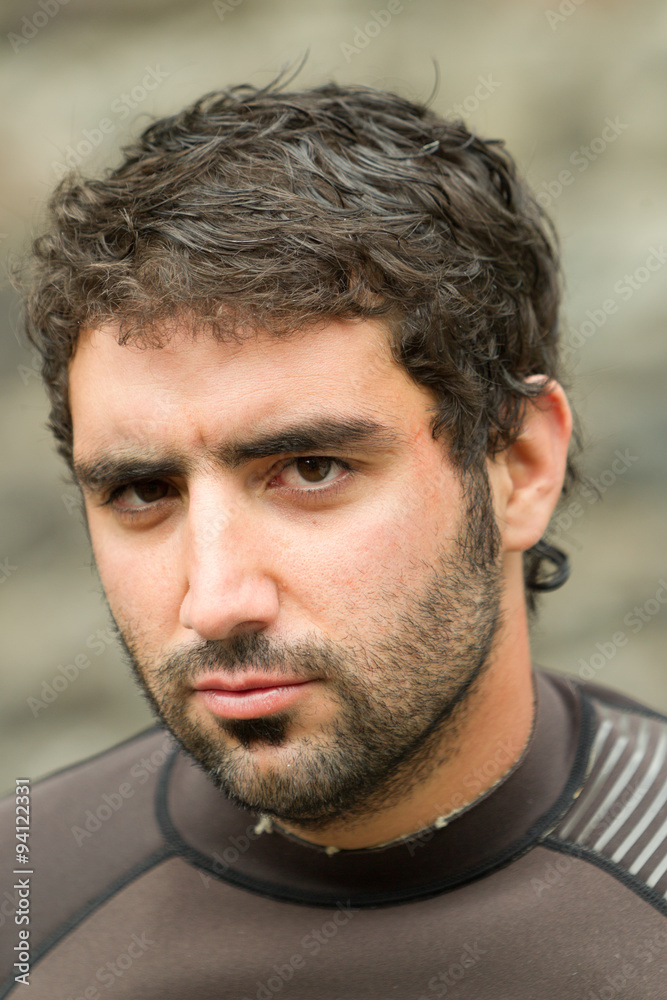 Adult man's face closeup wearing a neoprene wetsuit,perfect for water sports and diving enthusiasts seeking comfort and protection. Adult man's face closeup wearing a neoprene wetsuit,perfect for water sports and diving enthusiasts seeking comfort and protection.