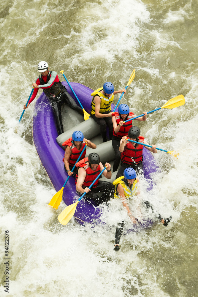 A thrilling white water rafting adventure in Ecuador with a skilled guide navigating through the rushing waters.