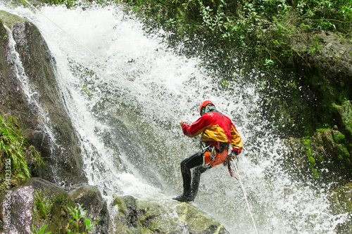 A thrilling descent down a canyon in Banos, Ecuador, as adrenaline junkies resist the rushing water of an extreme waterfall.