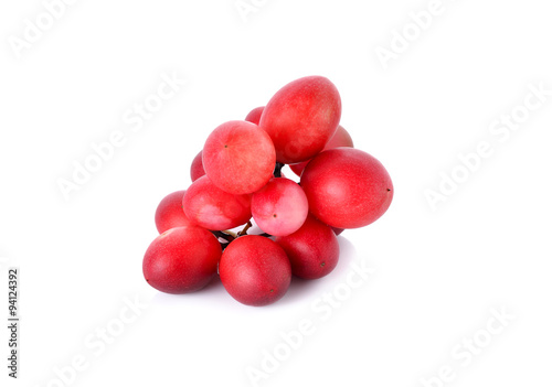 whole Carunda or Karonda fruit on white background