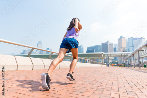 Woman running in a city at Hong Kong