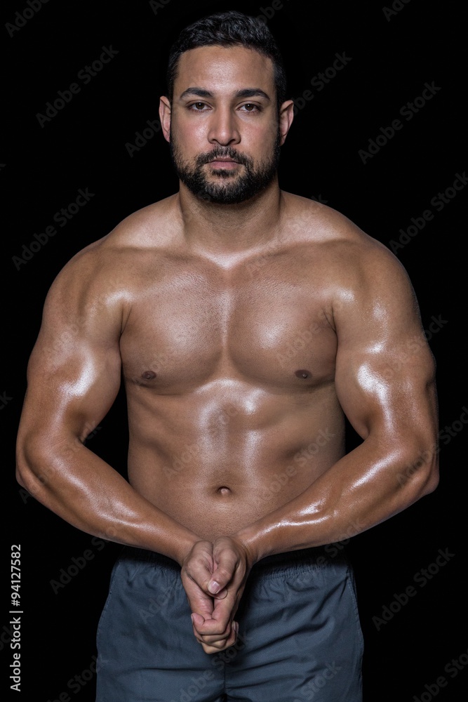 Portrait of a bodybuilder man flexing muscles Portrait of a bodybuilder man flexing muscles
