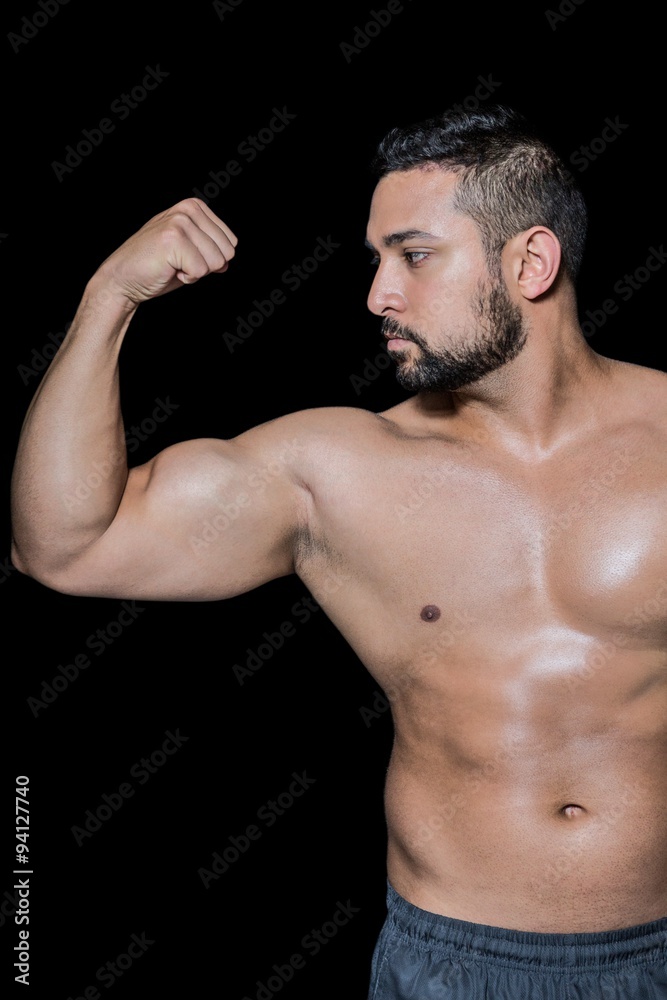 Bodybuilder man flexing his muscles Bodybuilder man flexing his muscles
