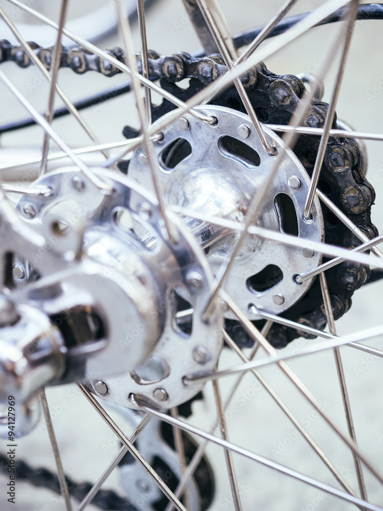 Bicycle wheel part with chain close up Bicycle wheel part with chain close up