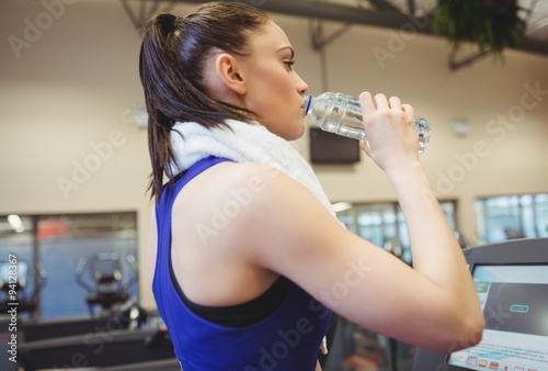 Fit woman taking a drink