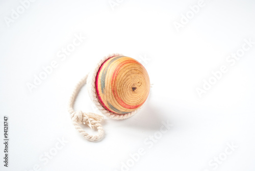 Wooden Pegtop on a White Background photo
